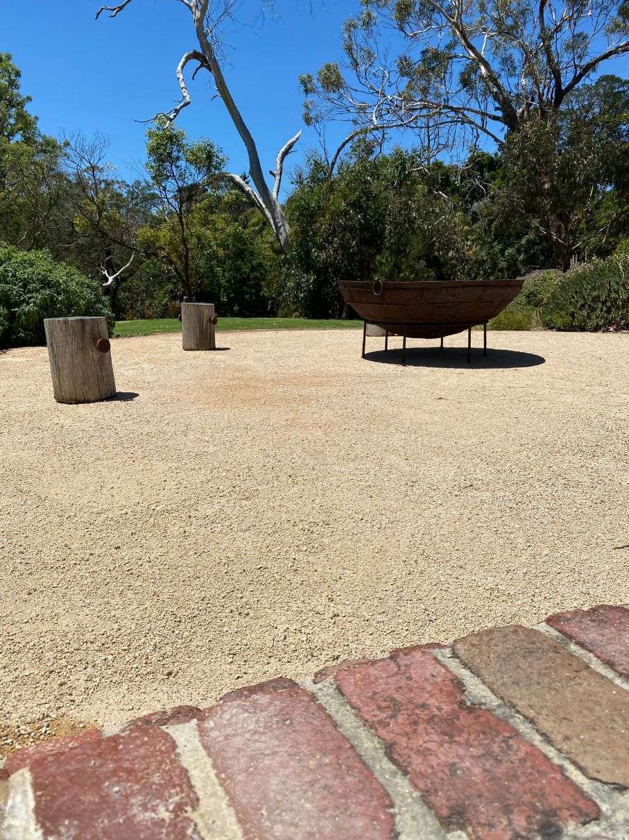 Round paving stones in newly planted garden