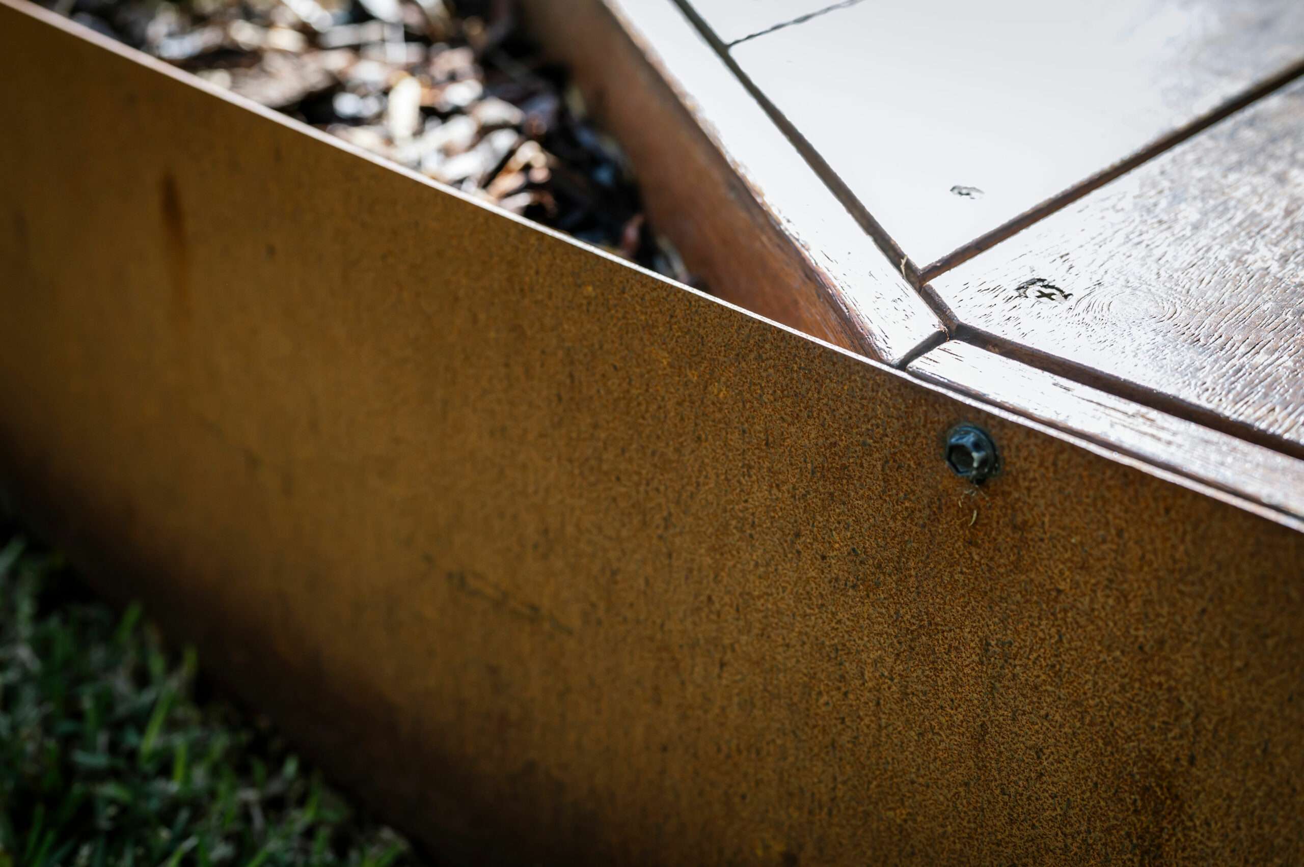 Corten Steel edging screwed to wooden deck