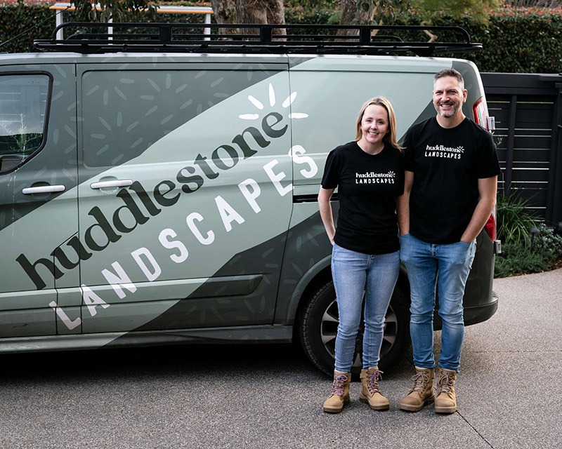 Shae and Steve in front of Huddlestone Landscapes van